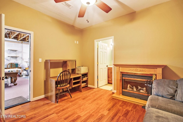 office with ceiling fan and light wood-type flooring