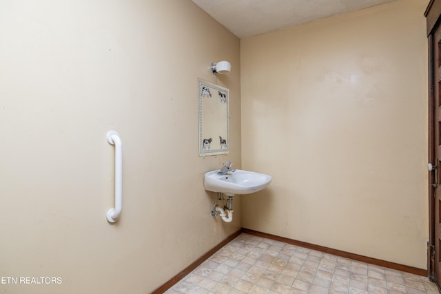 1227 N Main St, Sweetwater, TN 37874 - bathroom with a sink and baseboards