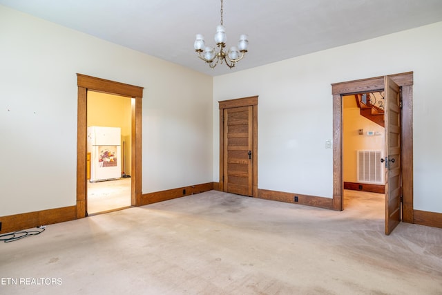 1227 N Main St, Sweetwater, TN 37874 - carpeted empty room with baseboards, visible vents, and a notable chandelier