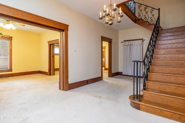 1227 N Main St, Sweetwater, TN 37874 - stairs with ceiling fan with notable chandelier, baseboards, and carpet