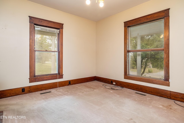 1227 N Main St, Sweetwater, TN 37874 - carpeted spare room featuring baseboards and visible vents