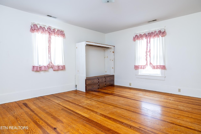 1227 N Main St, Sweetwater, TN 37874 - unfurnished bedroom featuring baseboards, visible vents, and wood finished floors