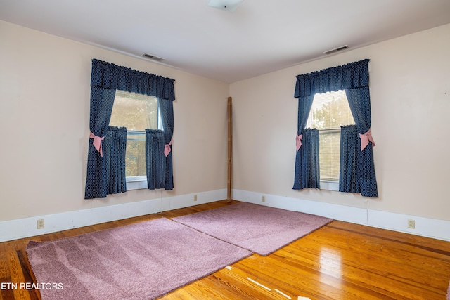 1227 N Main St, Sweetwater, TN 37874 - spare room with plenty of natural light, visible vents, and wood finished floors
