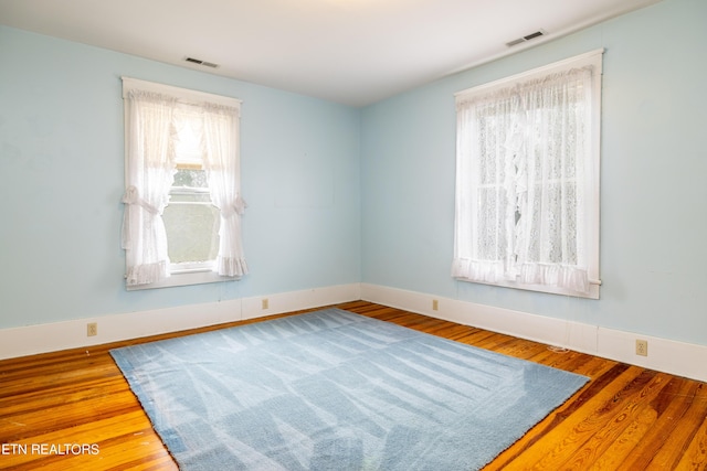 1227 N Main St, Sweetwater, TN 37874 - unfurnished room featuring baseboards, visible vents, and wood finished floors