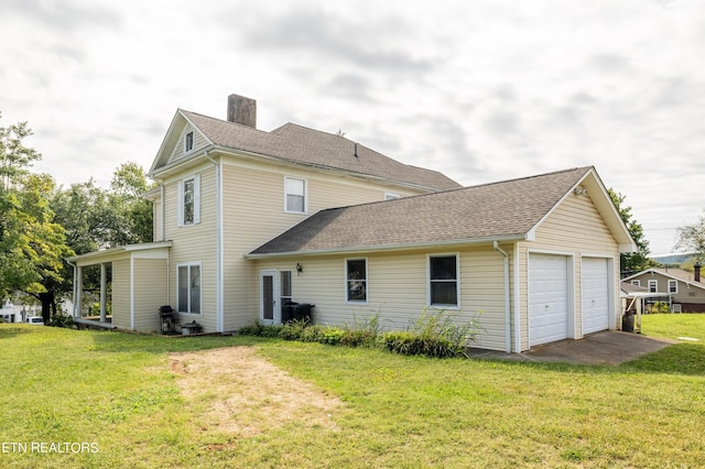 1227 N Main St, Sweetwater, TN 37874 - rear view of house featuring a chimney, a garage, a shingled roof, and a yard
