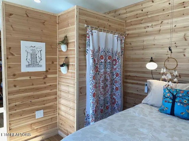 unfurnished bedroom with wooden walls