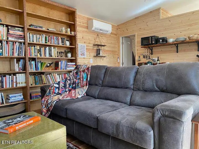 living room with a wall mounted AC and wood walls