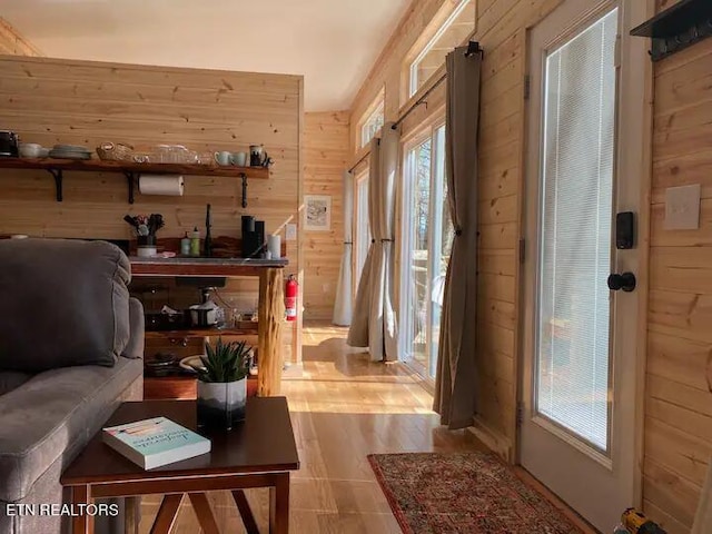 doorway with wood walls