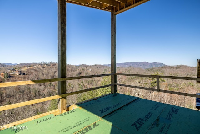 wooden terrace featuring a mountain view