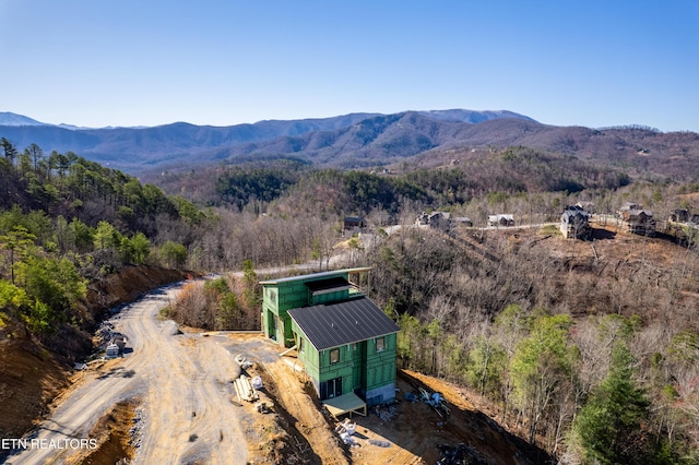 bird's eye view with a mountain view and a view of trees