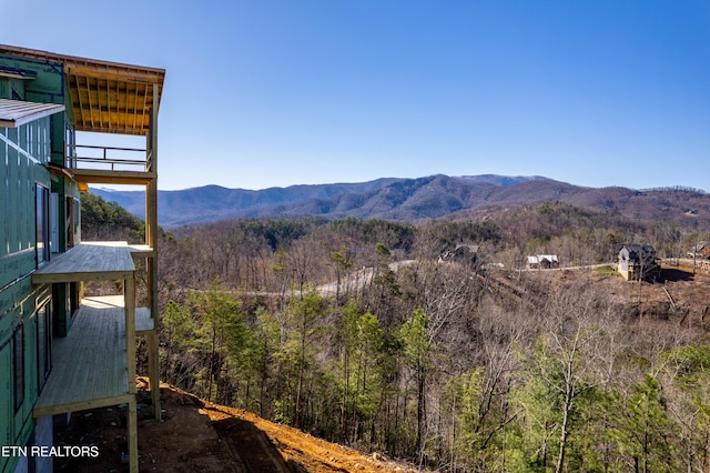 mountain view featuring a view of trees