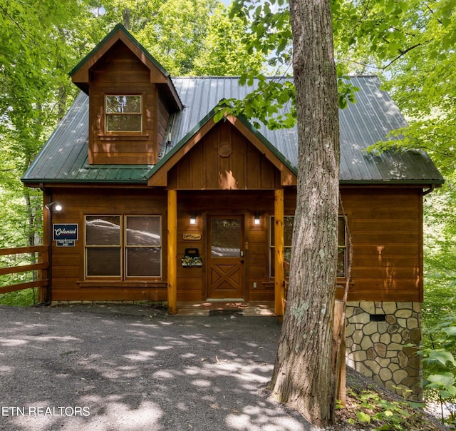 view of outbuilding with fence