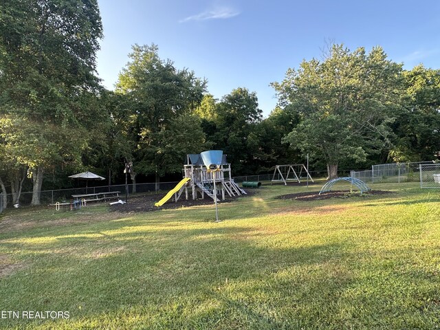 view of play area featuring a lawn