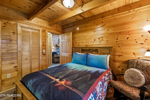 bedroom featuring wooden ceiling, a closet, beam ceiling, and wooden walls