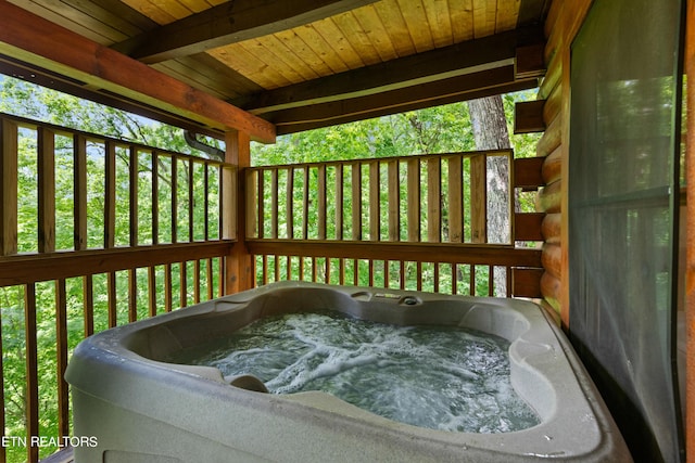 deck featuring a hot tub