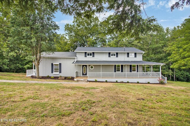 view of front of house with a front lawn and covered porch