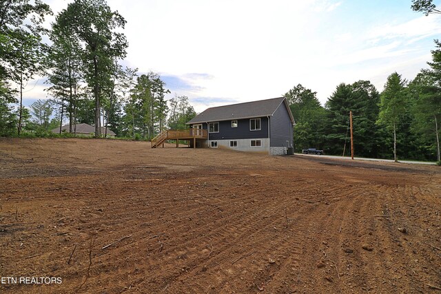 view of front facade with a wooden deck