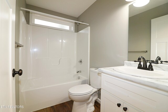 full bathroom featuring shower / bathtub combination, toilet, vanity, and hardwood / wood-style flooring