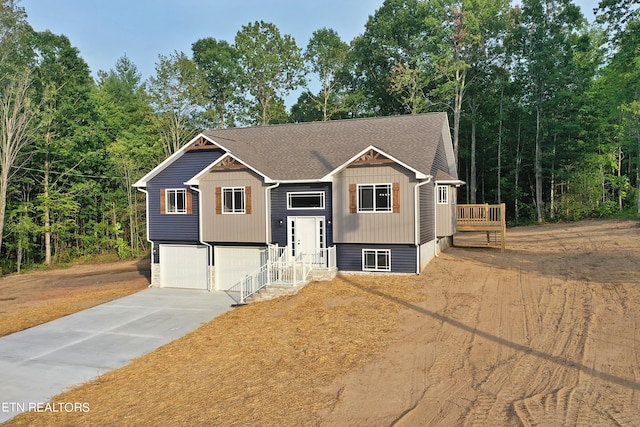 raised ranch featuring a garage