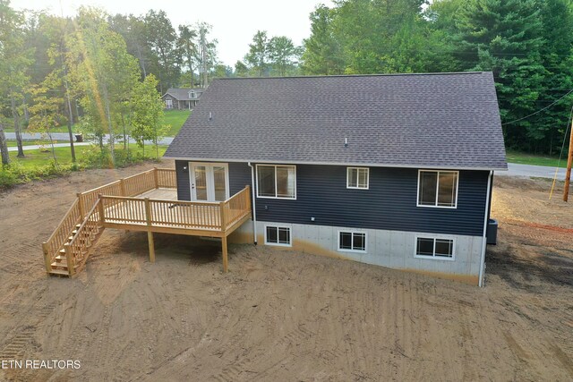 rear view of house featuring a deck