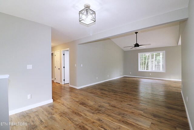 unfurnished room featuring wood-type flooring, ceiling fan, and vaulted ceiling