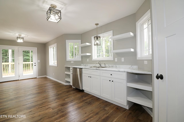 kitchen with sink, pendant lighting, light stone counters, stainless steel dishwasher, and dark wood-type flooring