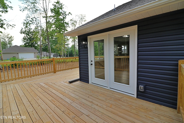 wooden deck featuring french doors