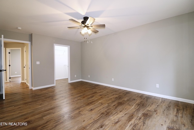 empty room featuring wood-type flooring and ceiling fan