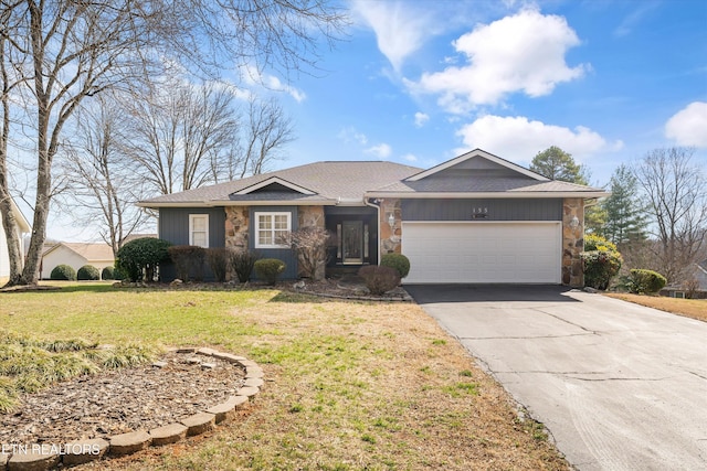 single story home featuring a garage, stone siding, and a front yard