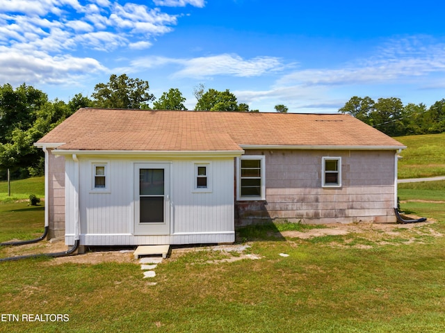 back of house with a yard