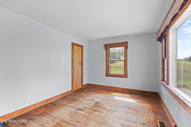 spare room featuring hardwood / wood-style flooring