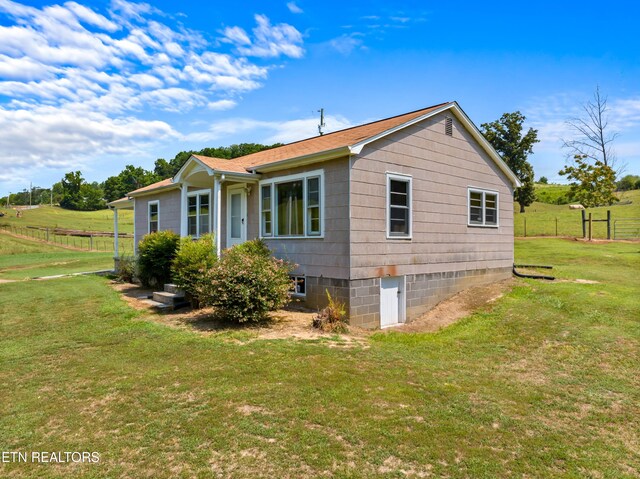 view of home's exterior featuring a lawn