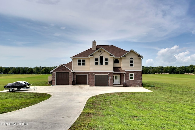 view of front of house featuring a garage and a front yard