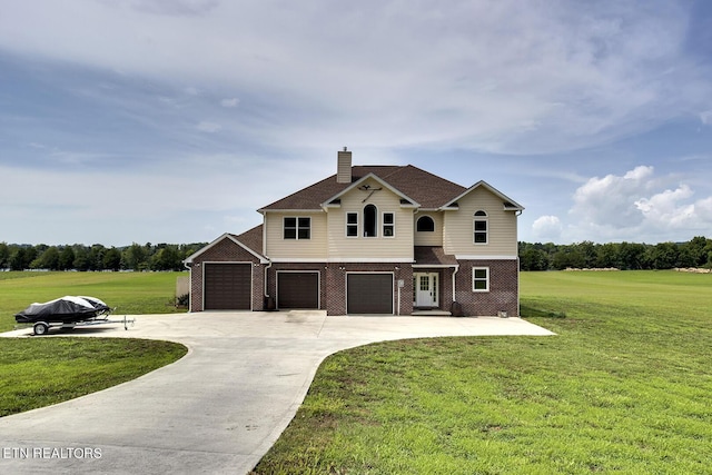 view of front of home featuring a garage and a front yard