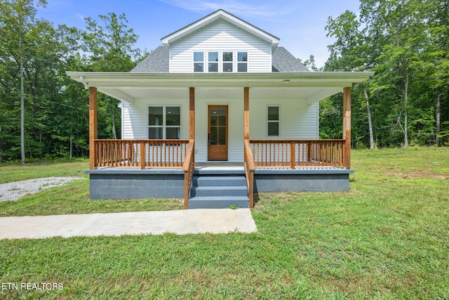 bungalow-style home featuring a front lawn and covered porch