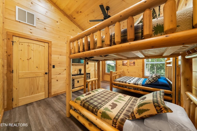 bedroom featuring vaulted ceiling, wood ceiling, dark hardwood / wood-style flooring, and wood walls