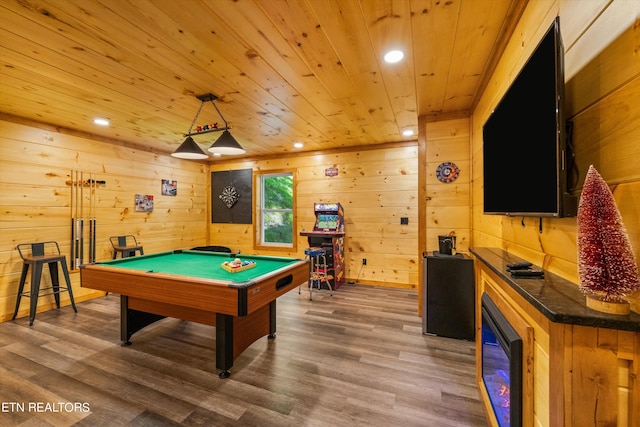 rec room featuring hardwood / wood-style flooring, pool table, wood ceiling, and wooden walls