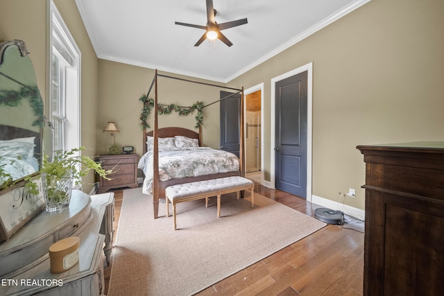 bedroom featuring crown molding, ceiling fan, and hardwood / wood-style floors