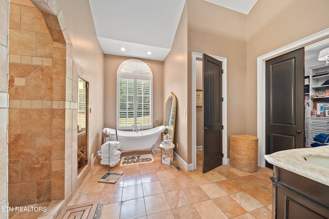 bathroom featuring vanity, tile patterned flooring, and independent shower and bath