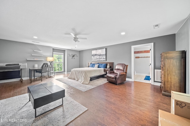 bedroom with hardwood / wood-style flooring and ceiling fan