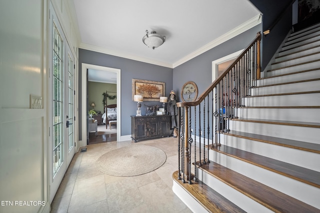 foyer entrance featuring french doors, light tile patterned floors, and ornamental molding