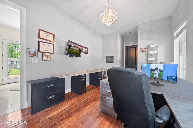 office featuring a notable chandelier and dark hardwood / wood-style flooring