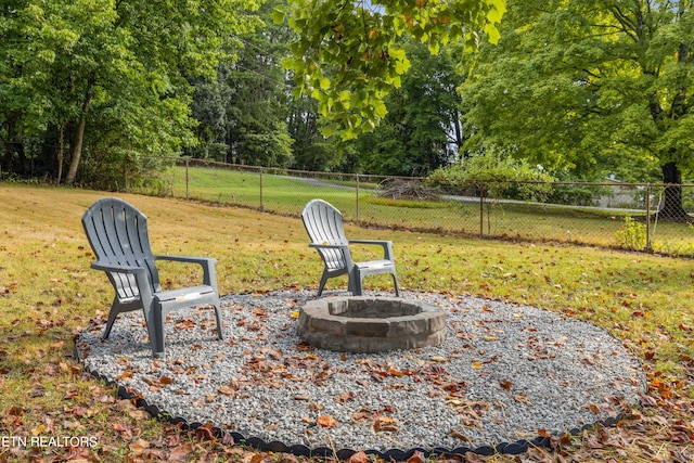 view of yard with an outdoor fire pit