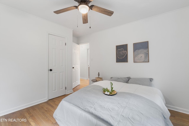 bedroom featuring ceiling fan and light hardwood / wood-style floors