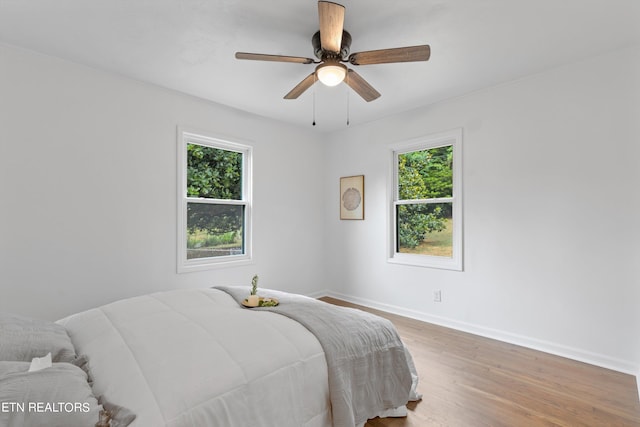 bedroom featuring hardwood / wood-style flooring and ceiling fan