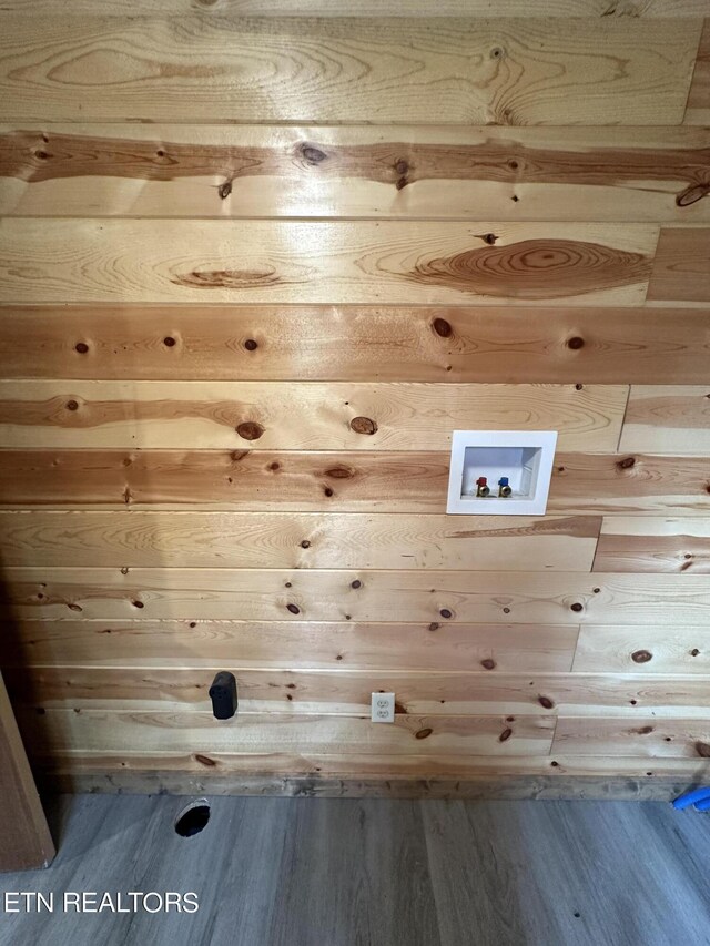 laundry area with hookup for a washing machine and hardwood / wood-style floors