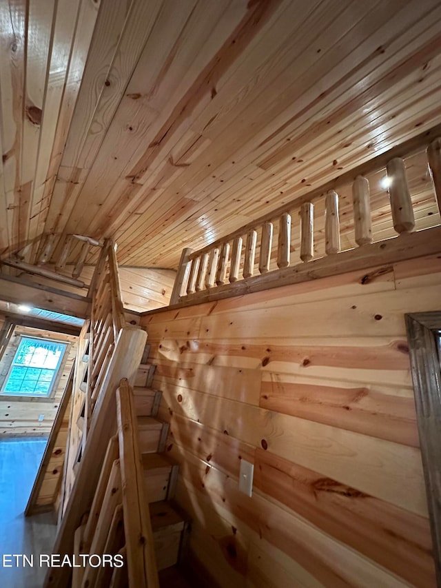 room details featuring wooden walls and wood ceiling