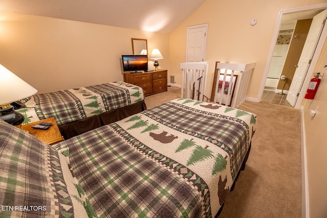 bedroom featuring lofted ceiling and carpet floors