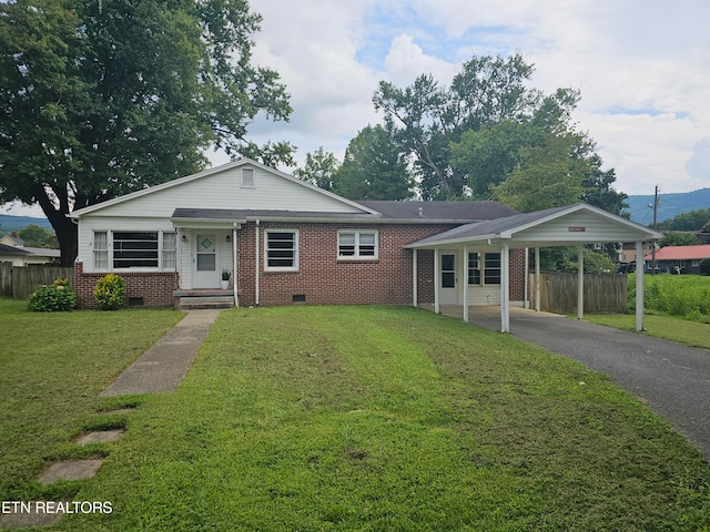 single story home with a carport and a front lawn