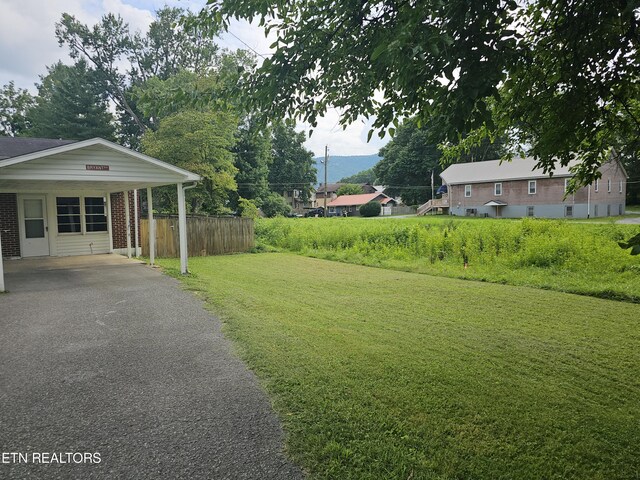 view of yard with a carport